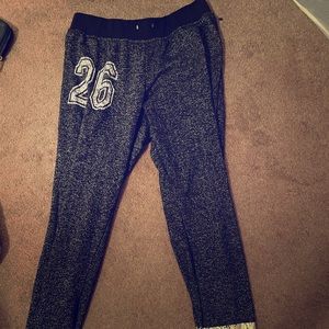 Black and white sweatpants with the number “26”